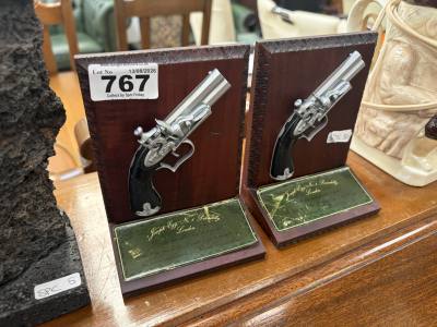 PAIR OF PISTOL BOOKENDS