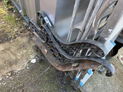 PAIR OF CAST BENCH ENDS
