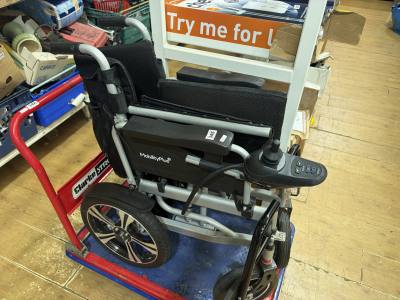 ELECTRIC WHEELCHAIR (CHARGER IN OFFICE)
