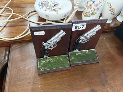 PAIR OF PISTOL BOOKENDS