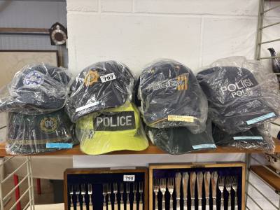 COLLECTION OF 8 MIXED REGION POLICE HATS