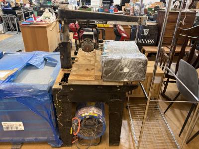 DEWALT SLIDING SAW ON TABLE (NEEDS BLADE)