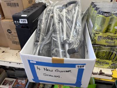BOX OF NEW GUITAR STANDS