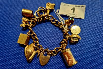 9CT GOLD CHARM BRACELET 35.2 GRAMS