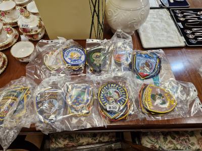11 X PACKS OF POLICE BADGES