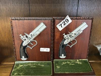 PAIR OF PISTOL BOOKENDS