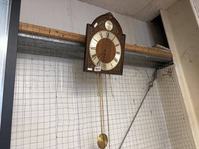WEIGHTED WALL CLOCK